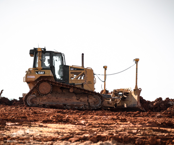 Cat Bulldozer Moving Dirt At Utilities Job Site