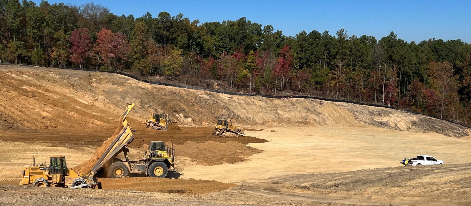 Projects-Industrial-I-77 Mega Site-dump trucks and earth moving trucks on a large construction site
